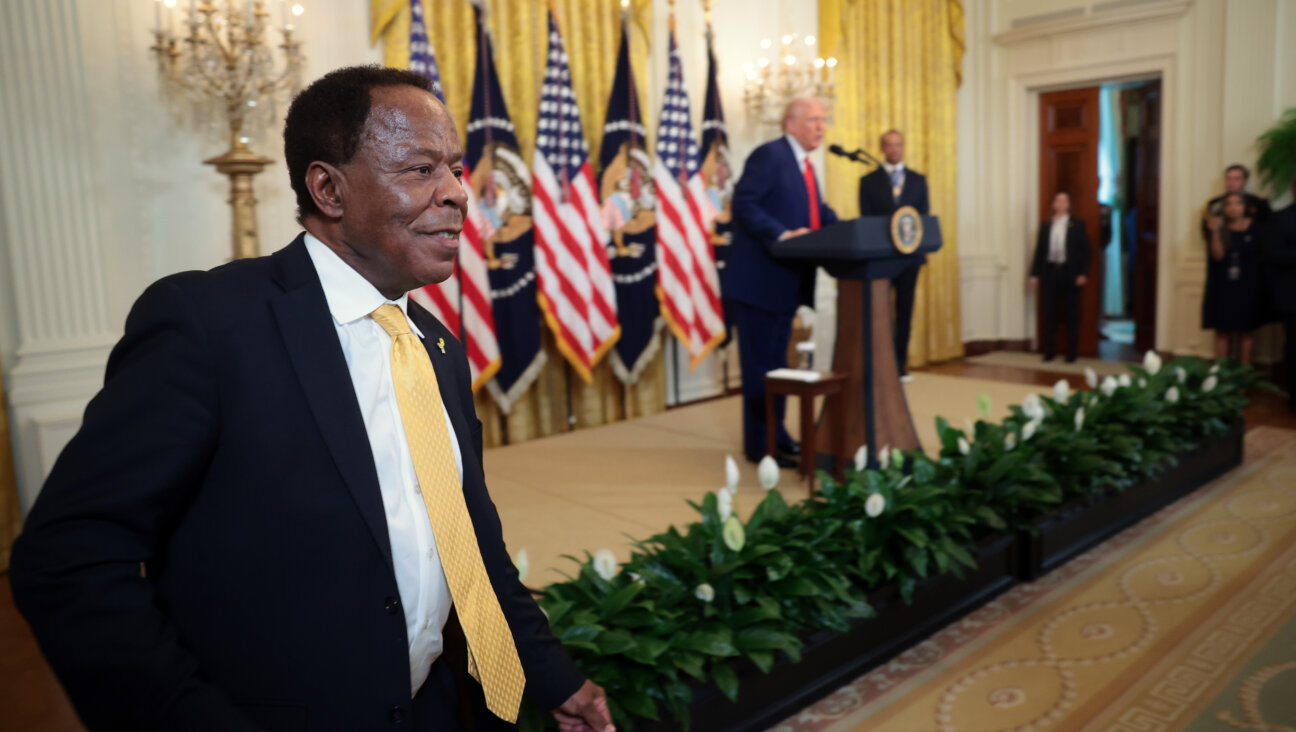 Civil rights attorney Leo Terrell leaves the stage after speaking alongside President Donald Trump and golf legend Tiger Woods during a reception honoring Black History Month at the White House on February 20.