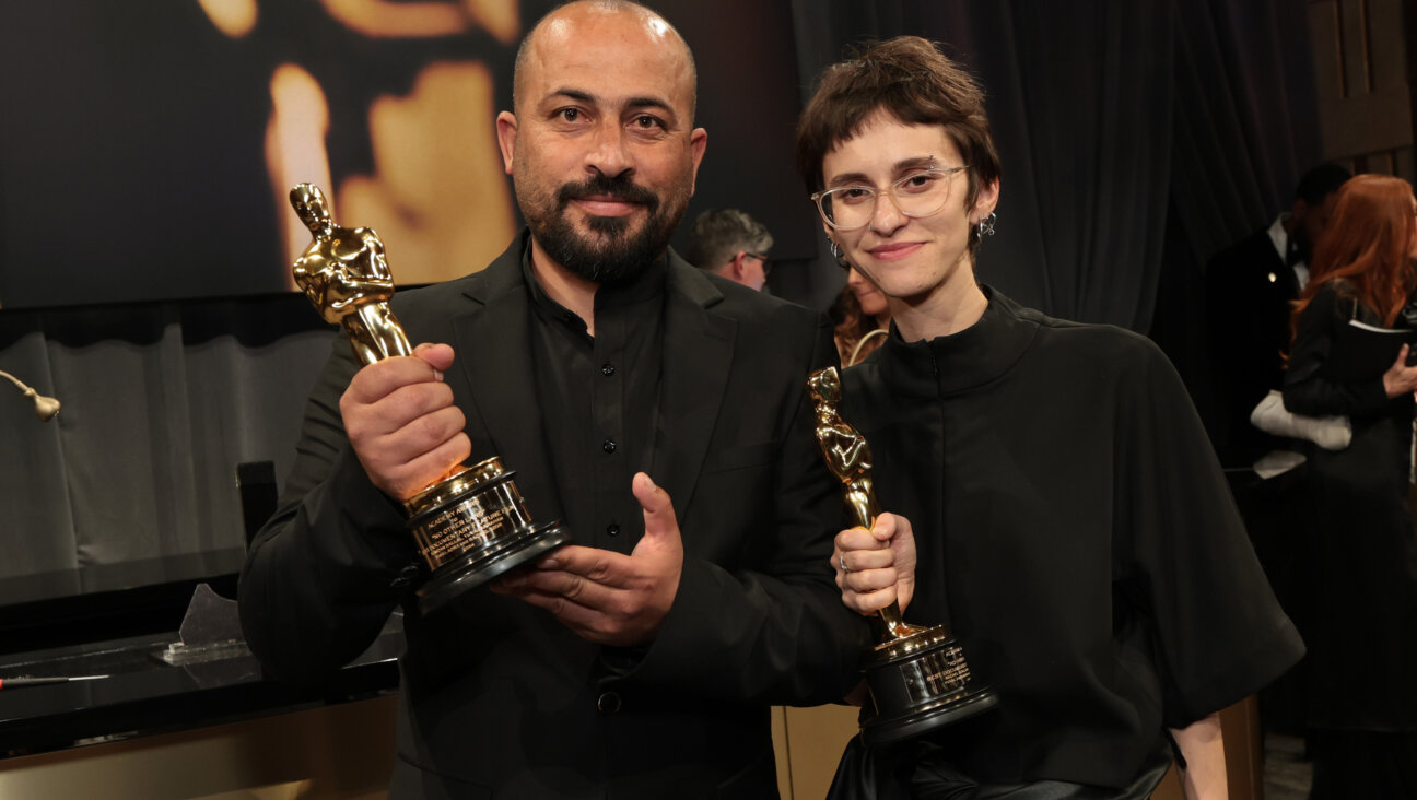 (L-R) Hamdan Ballal and Rachel Szor, winners of the Best Documentary Feature Film for "No Other Land", attend the 97th Annual Oscars Governors Ball.