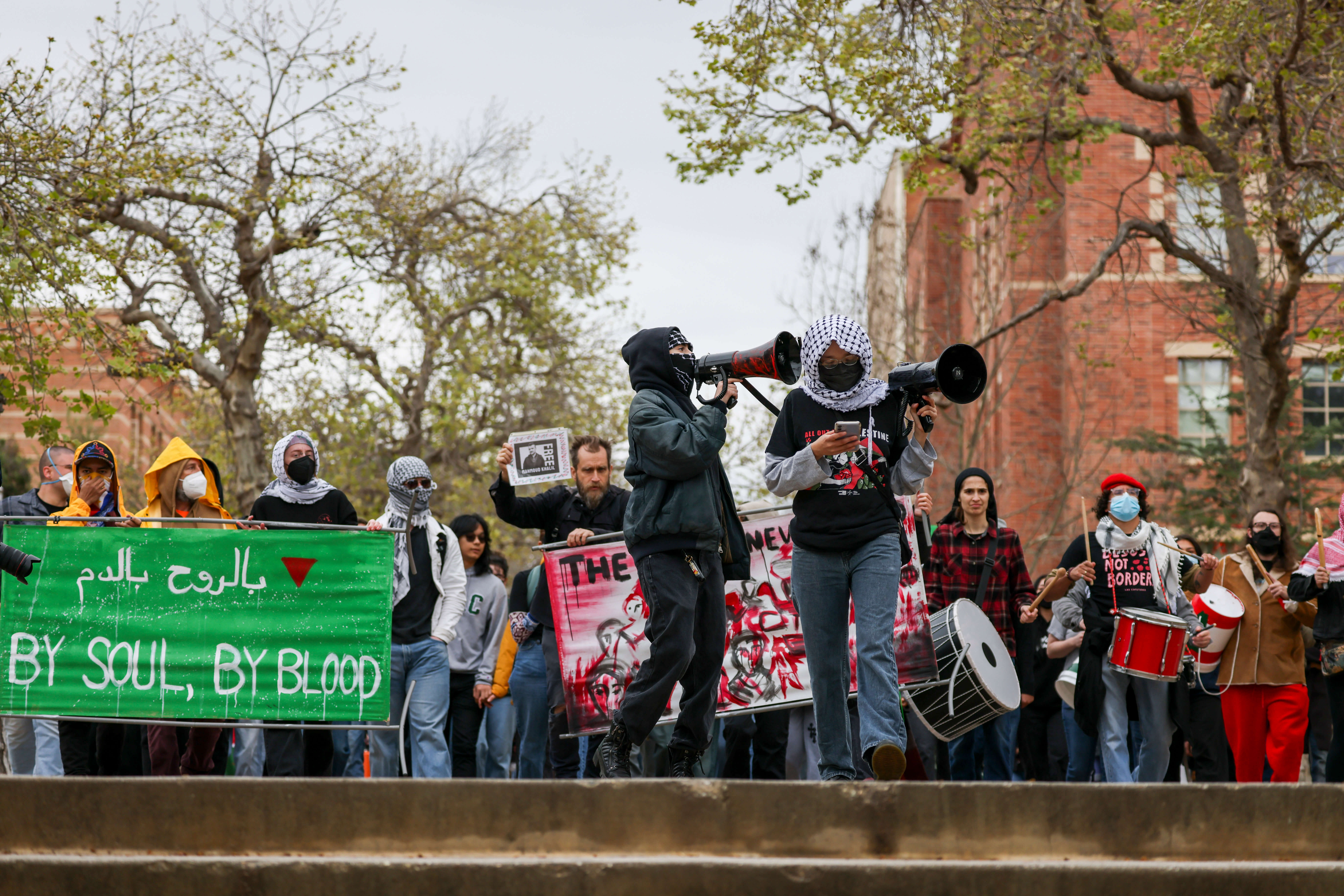 Pro-Palestinian protesters march at UCLA on Tuesday, opposing ICE's detainment of Mahmoud Khalil, a Palestinian activist who led protests at Columbia University last year.