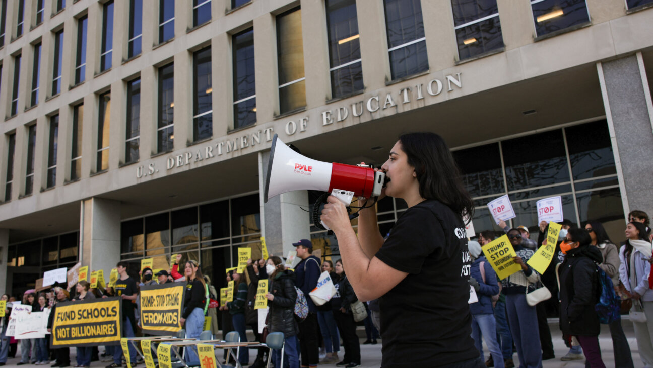 Demonstrators gather outside of the offices of the U.S. Department of Education in Washington, D.C. on March 13, 2025 to protest against mass layoffs and budget cuts at the agency, initiated by the Trump administration and DOGE.