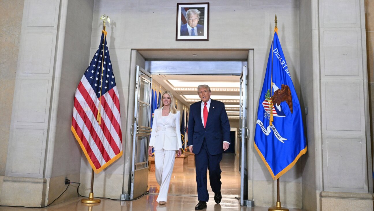 US President Donald Trump and Attorney General Pam Bondi arrive to speak at the Department of Justice in Washington, DC, on March 14, 2025. (Roberto Schmidt/AFP via Getty Images)