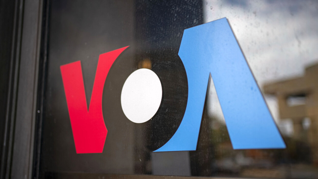 A sign in the window of the Voice of America's office in Washington, D.C.