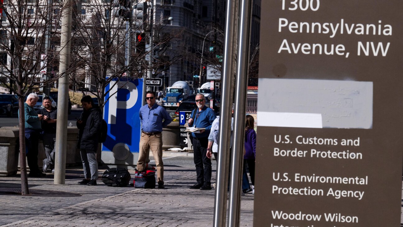 On a sign for the US Agency for International Development (USAID)office, the name has been painted over.