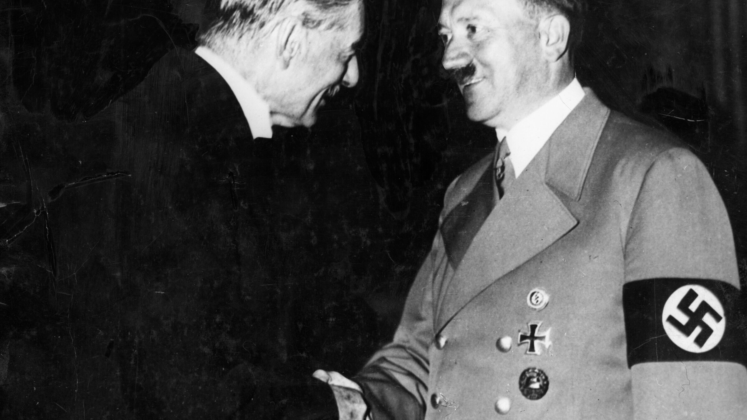 On Sept 23, 1938,  Neville Chamberlain and Adolf Hitler shake hands during their meeting at the Hotel Dreesen at Godesberg.  