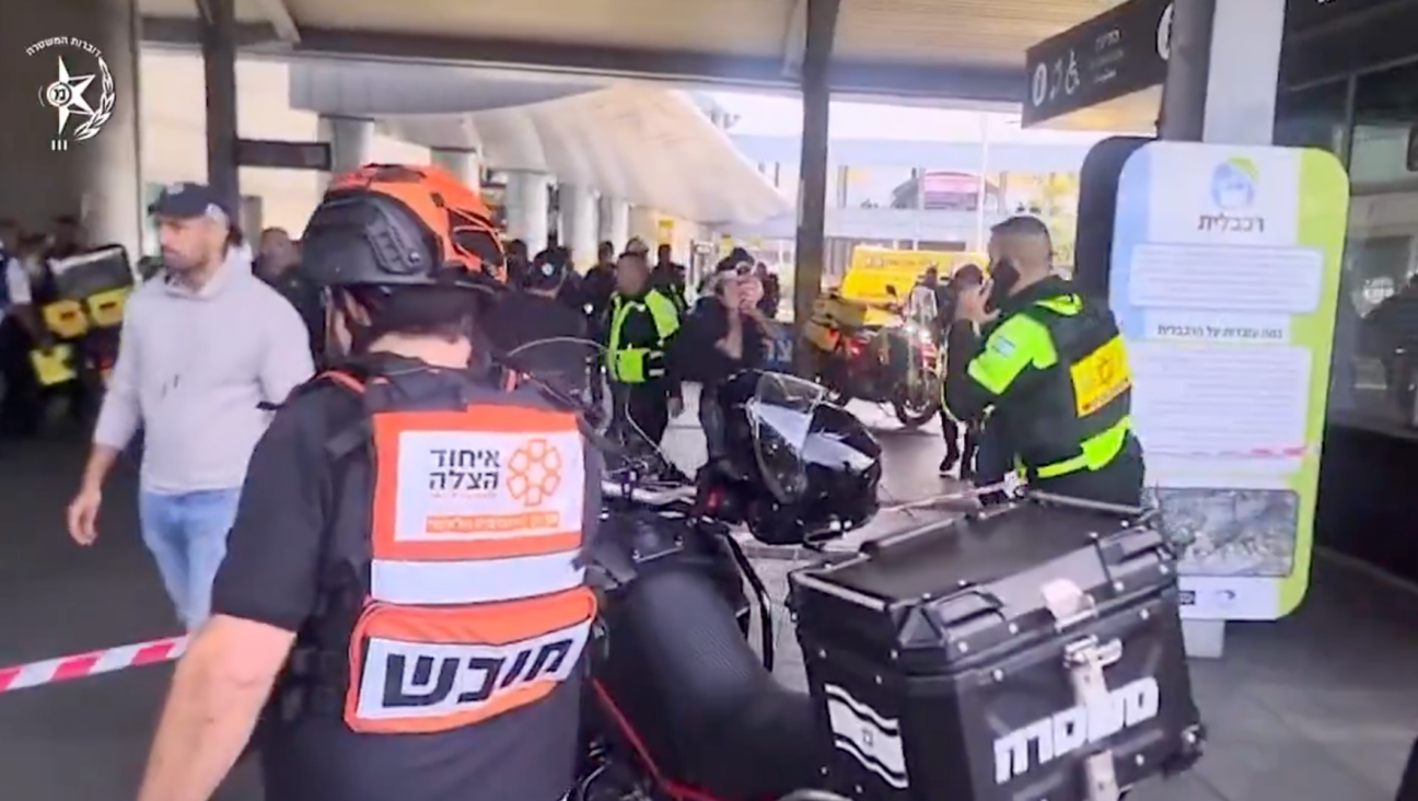 Police and first responders at the site of a stabbing attack in Haifa on March 3, 2025. (Screenshot)