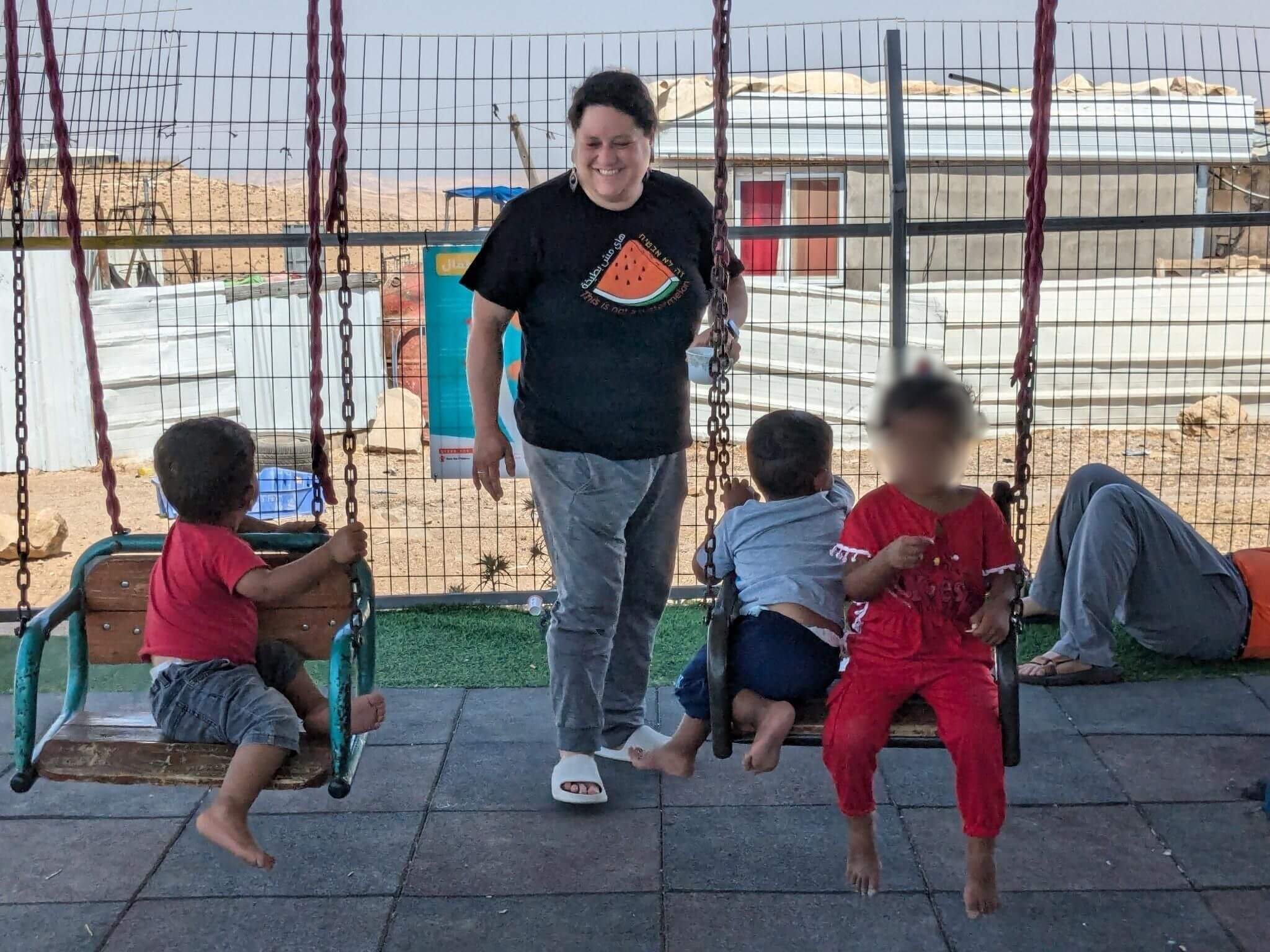 ACTIVIST WITH PALESTINIAN KIDS