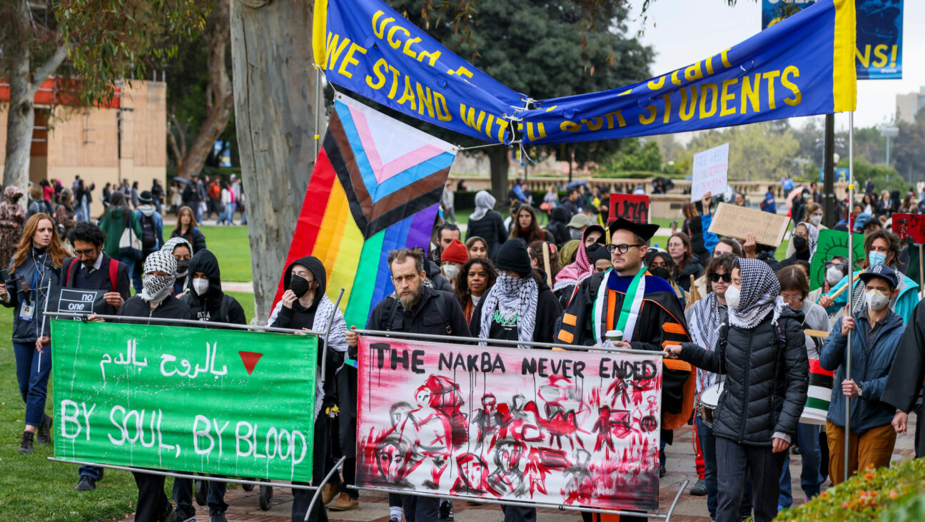 Pro-Palestinian demonstrators march in Royce Quad at UCLA on March 11 in protest of ICE's detainment of Mahmoud Khalil, a Palestinian activist who led protests at Columbia University last year. 