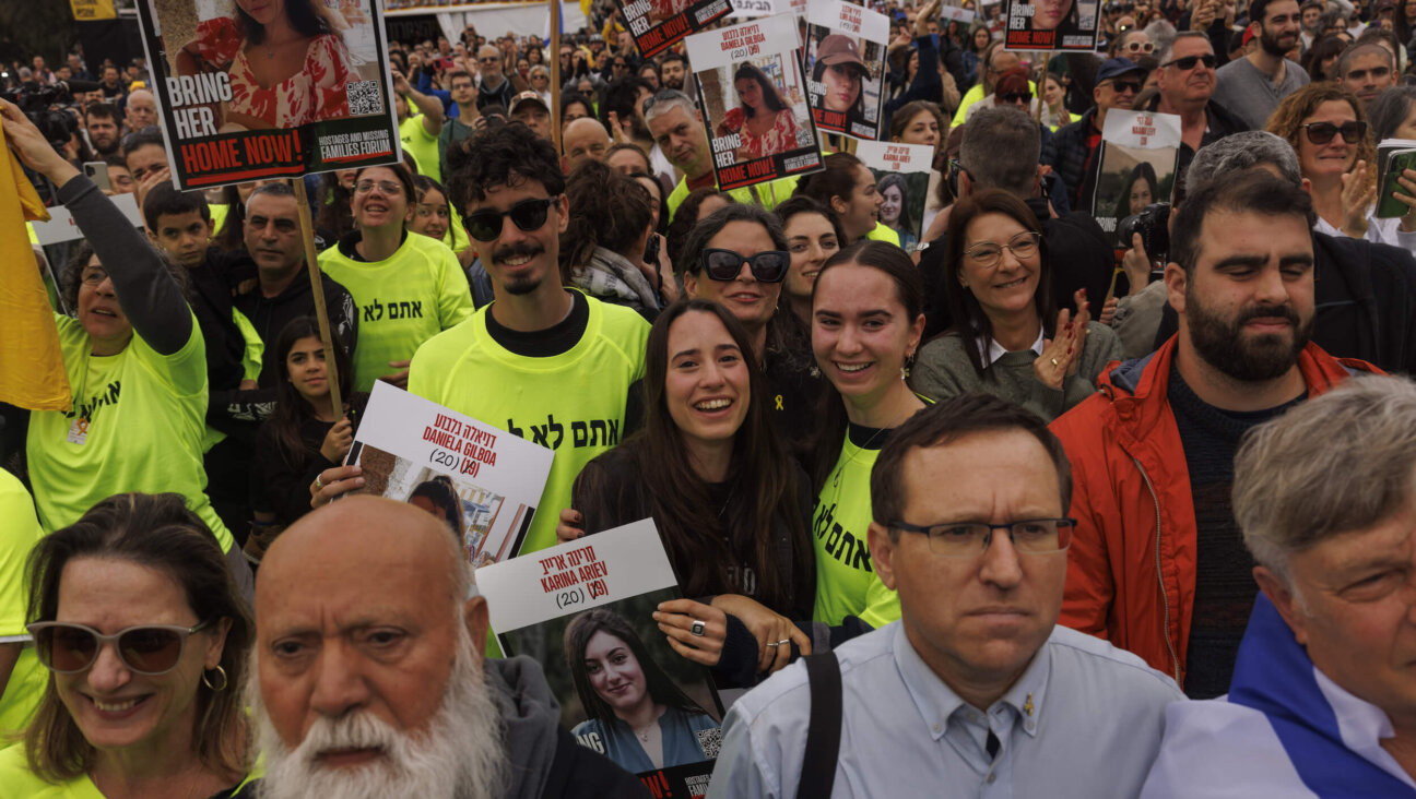 Relatives and friends of Israeli people killed or taken hostage by Hamas smile as they watch a live stream and follow the news of the hostages' release, in Tel Aviv, Israel, on Jan. 25. 