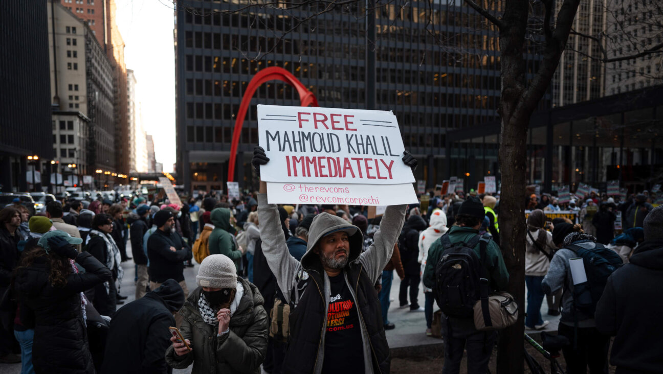 Activists march through downtown Chicago to show support for recent Columbia graduate Mahmoud Khalil, a green card holder recently arrested by ICE, on March 11.