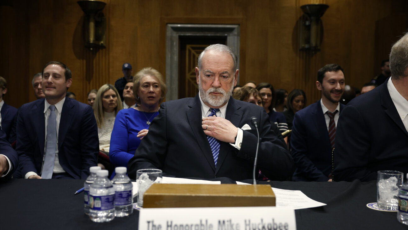 Former Arkansas Gov. Mike Huckabee, President Donald Trump's nominee to be ambassador to Israel, arrives to testify during his Senate Foreign Relations Committee confirmation hearing on March 25. 