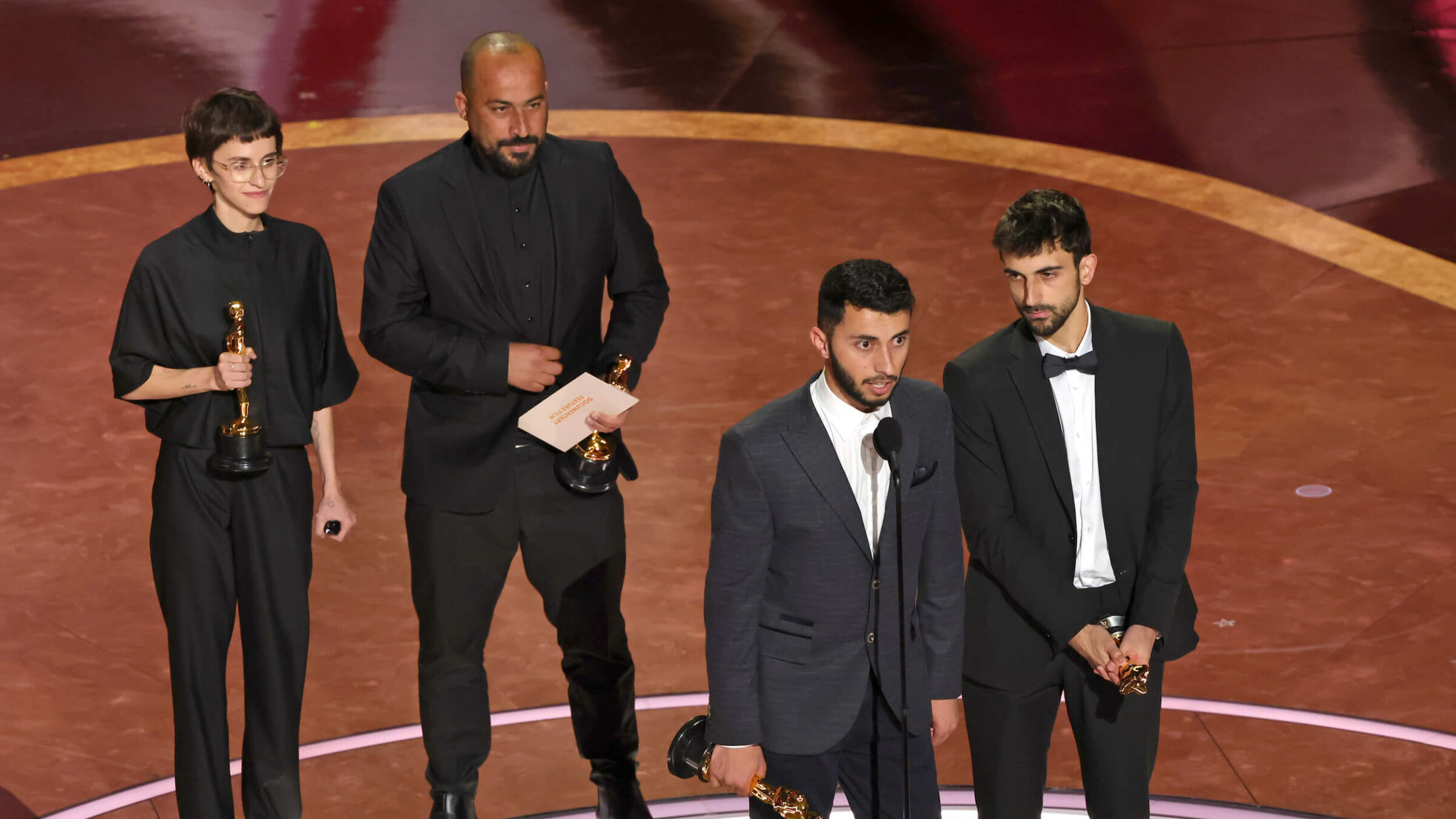 The team behind <I>No Other Land</I> accept their Oscar for best documentary.