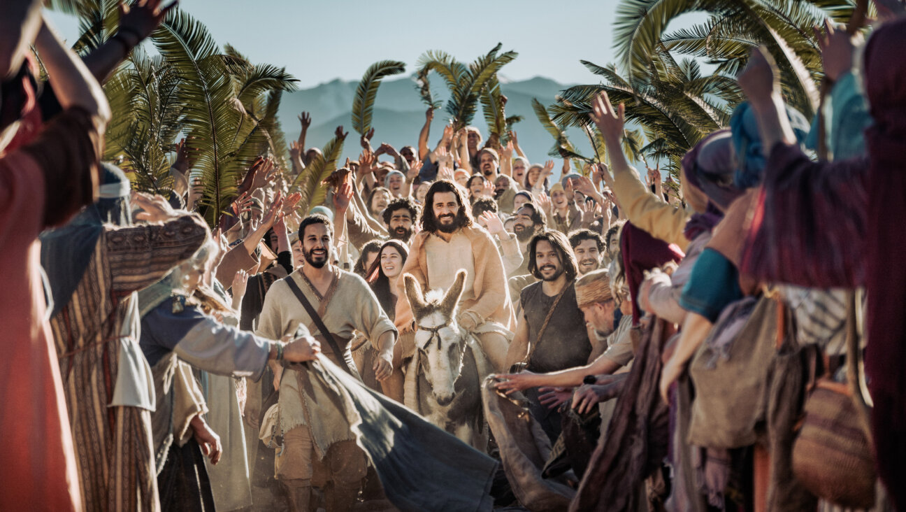Jesus arrives to Jerusalem on what will later be known to Christians as Palm Sunday.