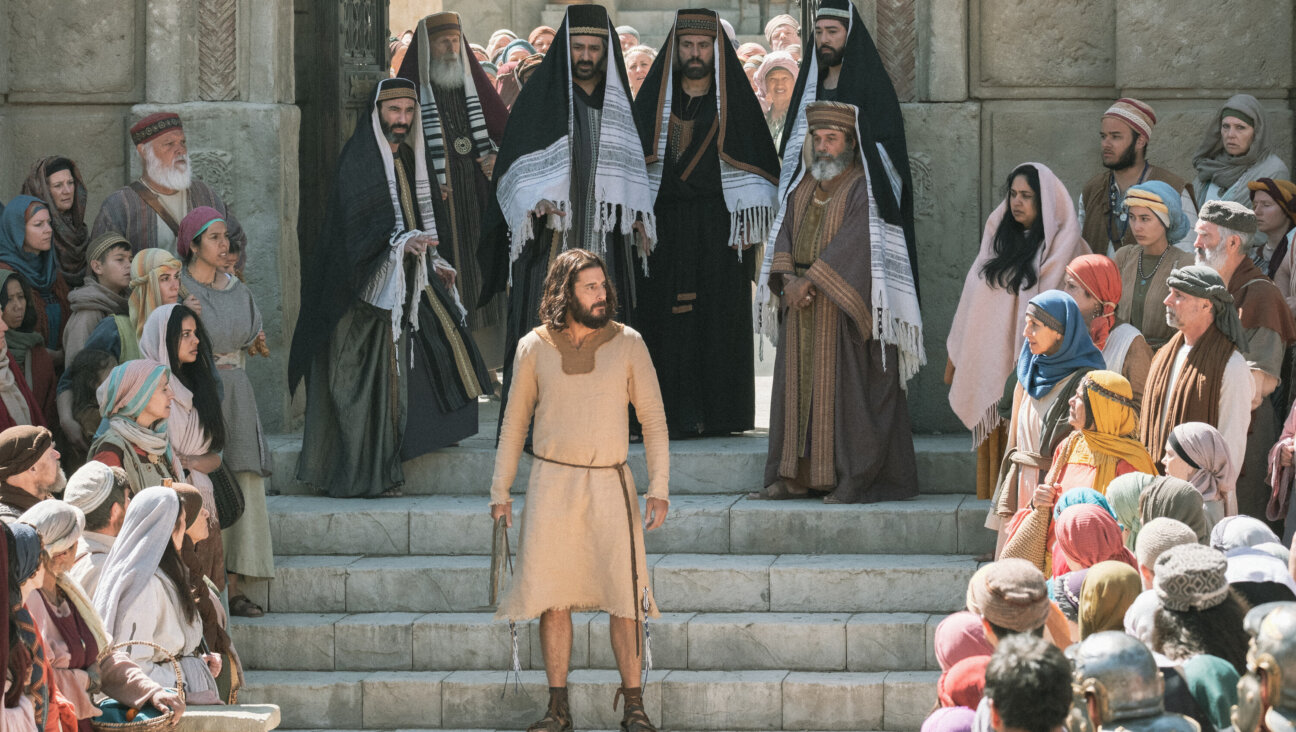 A shot from the most recent season of <i> The Chosen </i> after overturning the tables in the temple courtyard.