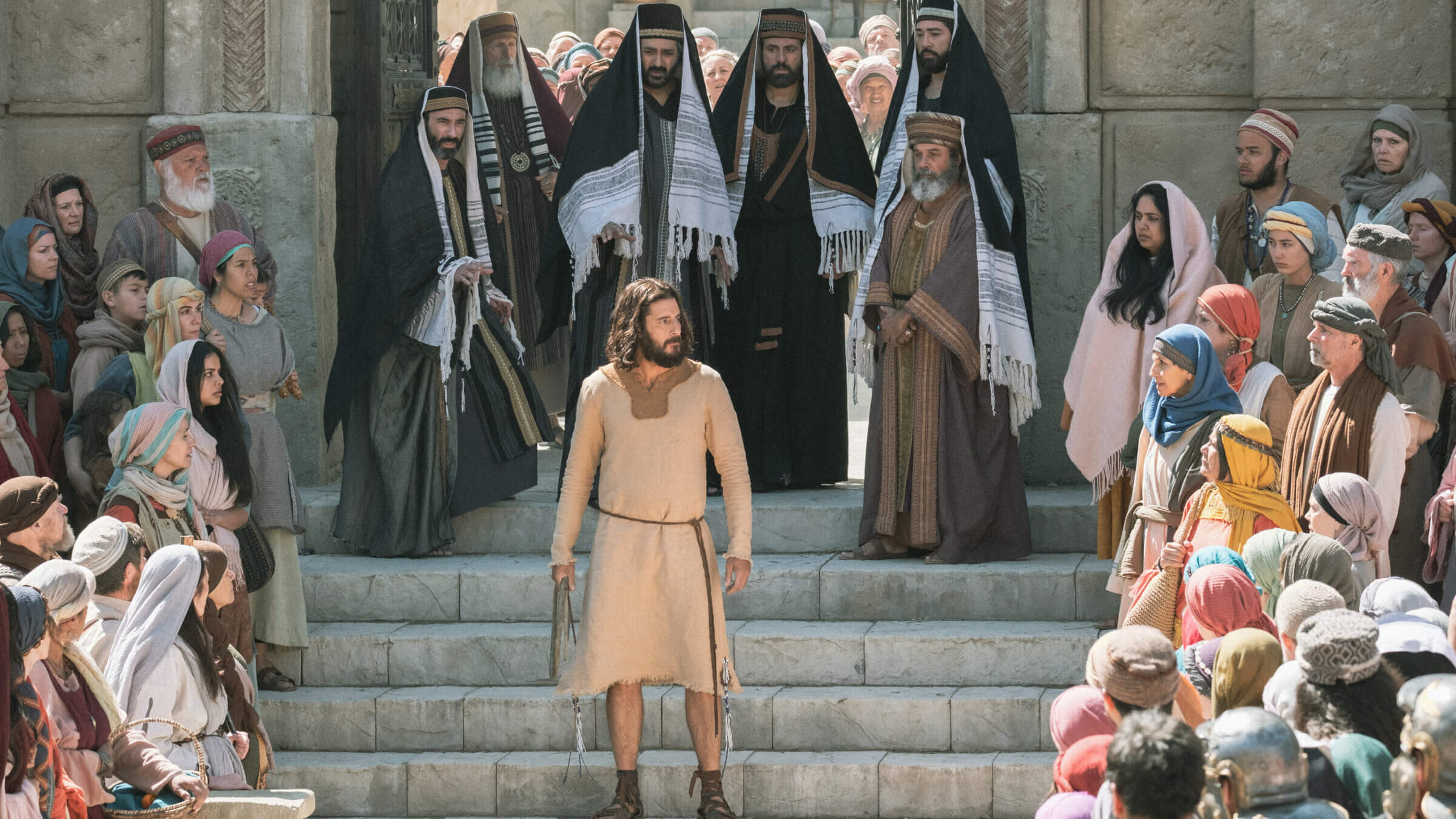 A shot from the most recent season of <i> The Chosen </i> after overturning the tables in the temple courtyard.