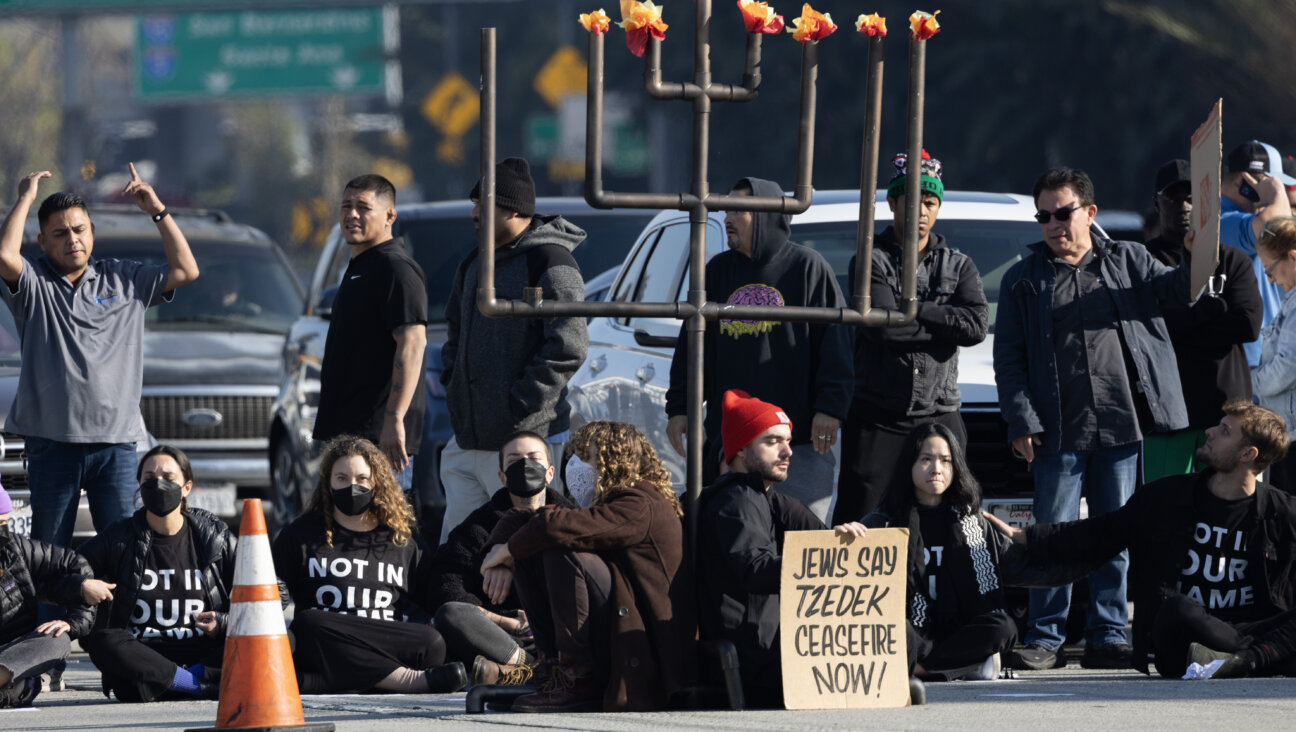 Protesters from the left-wing Jewish group IfNotNow shut down a Los Angeles freeway in downtown on Dec. 13, 2023 to call for a ceasefire in the Israeli-Hamas conflict.