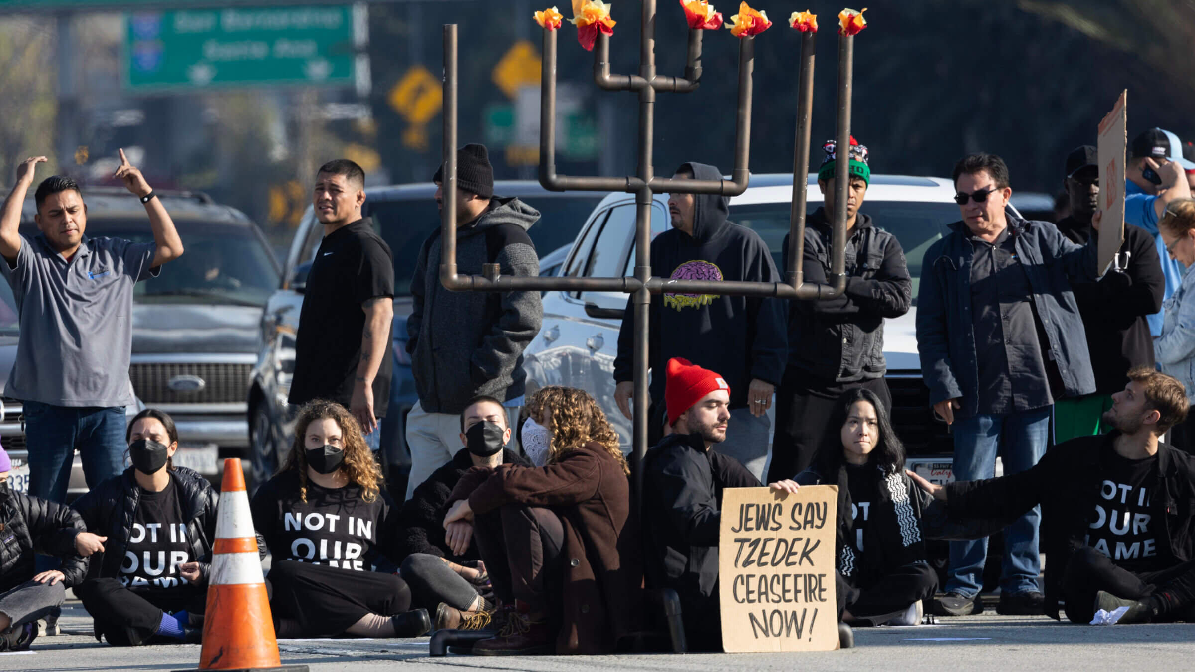 Protesters from the left-wing Jewish group IfNotNow shut down a Los Angeles freeway in downtown on Dec. 13, 2023 to call for a ceasefire in the Israeli-Hamas conflict.