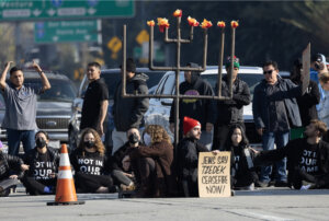 Protesters from the left-wing Jewish group IfNotNow shut down a Los Angeles freeway in downtown on Dec. 13, 2023 to call for a ceasefire in the Israeli-Hamas conflict.