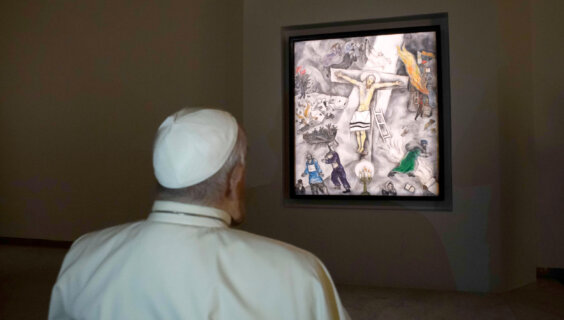Pope Francis examines Marc Chagall's <i>White Crucifixion</i> during its exhibition in Rome on Dec. 8, 2024. 