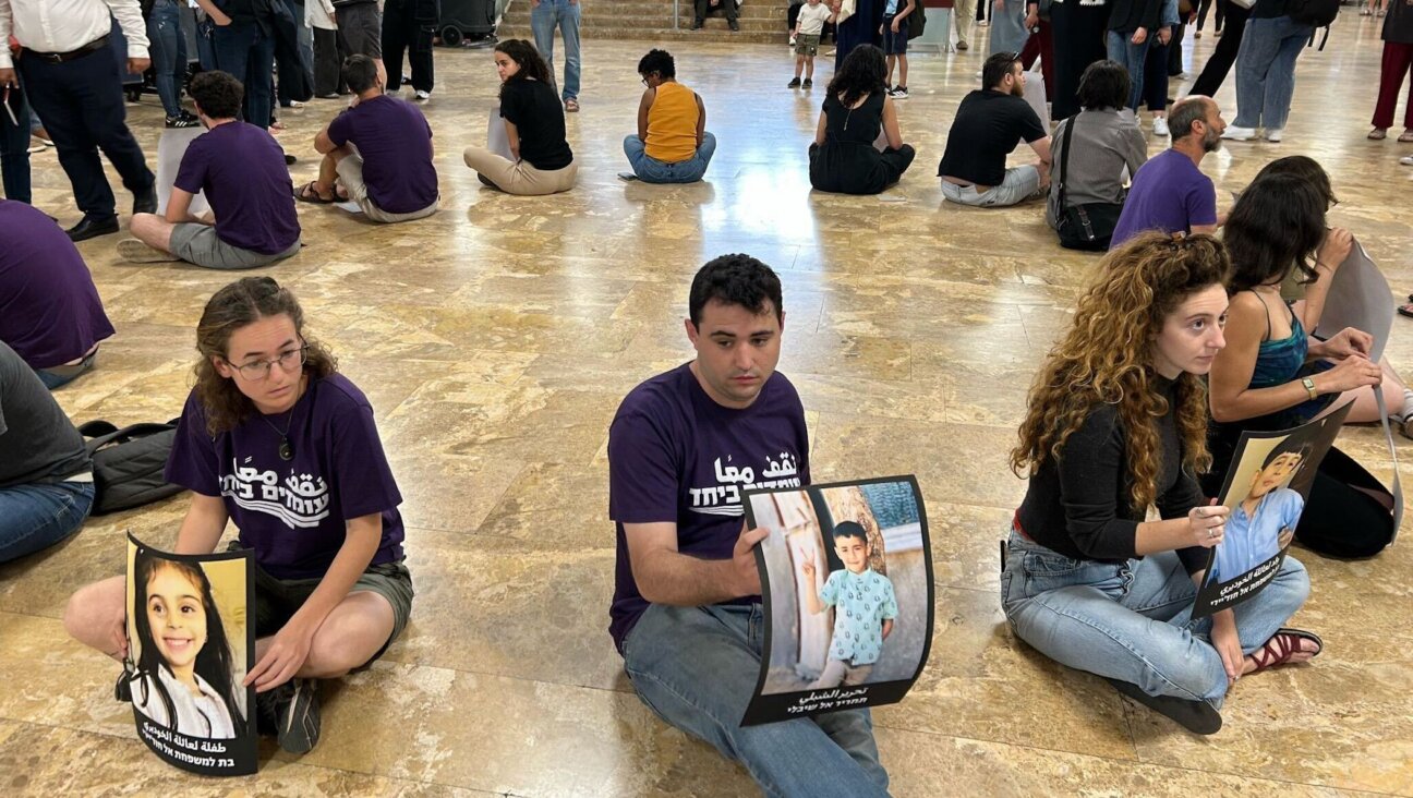 Activists with the group Standing Together hold a silent protest at the University of Haifa in April 2025. (Alma Barski)