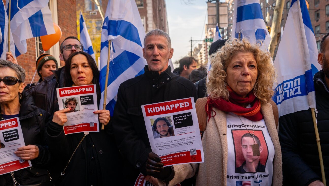 Left wing Israeli leader Yair Golan alongside protesters outside the home of U.N. Secretary-General Antonio Guterres, December 8, 2024. (Luke Tress)
