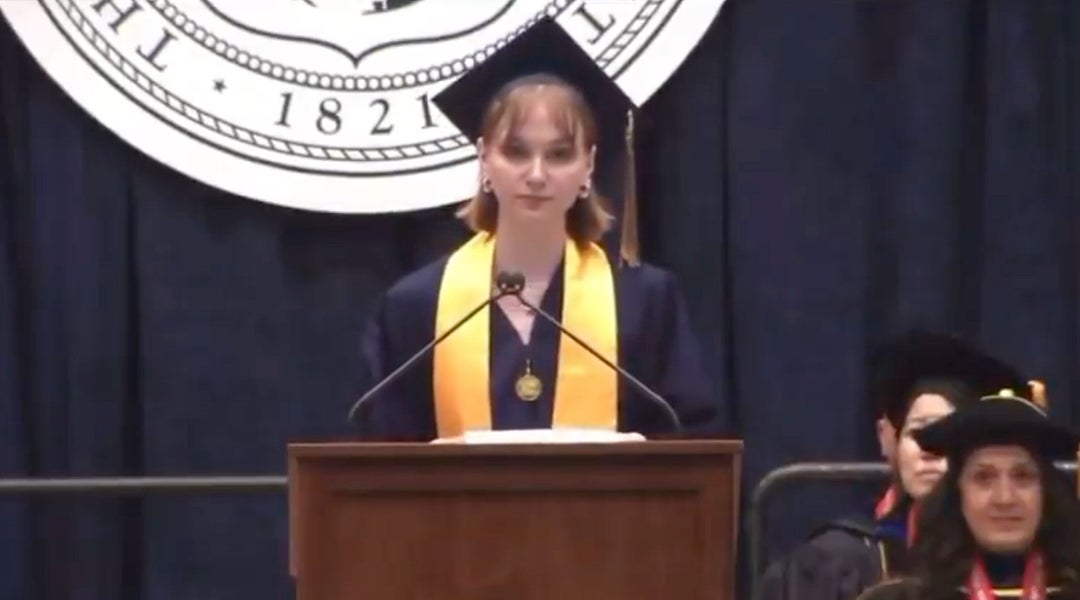 Cecilia Culver, a recent graduate of George Washington University, uses her commencement speech to urge her fellow graduates not to donate to the university unless it divests from Israel, May 17, 2025, Washington, D.C. The school banned her from campus as a result of her speech. (Screenshot via X)