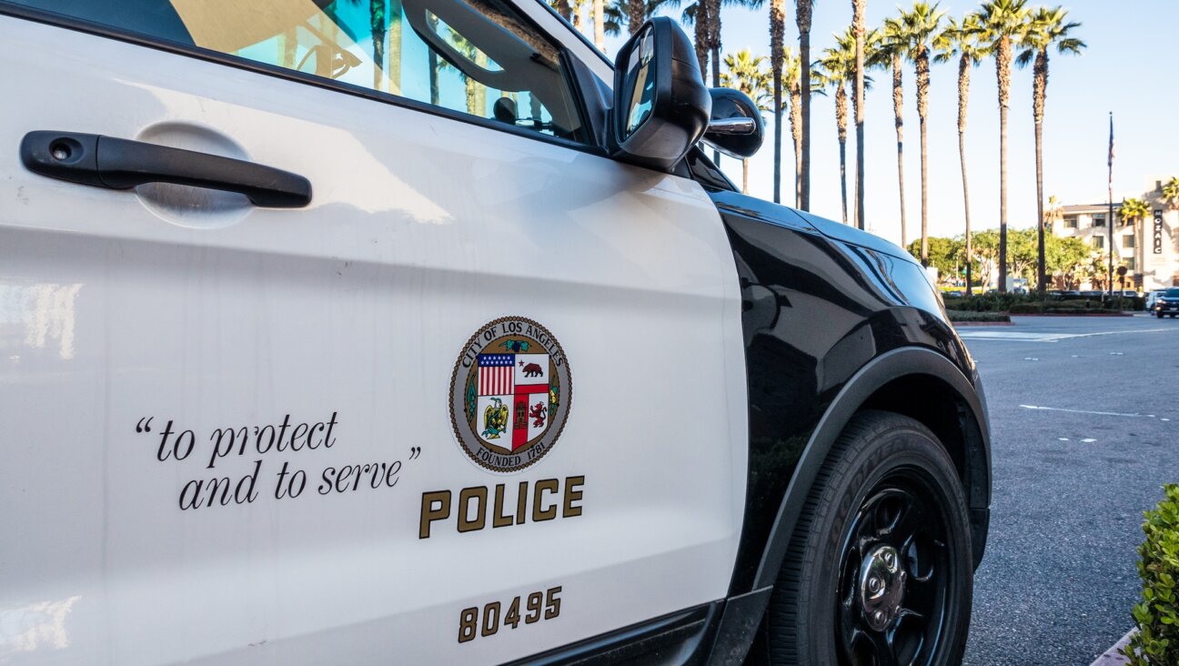 Close-up on the insignia and slogan of a LAPD vehicle. (Getty Images)