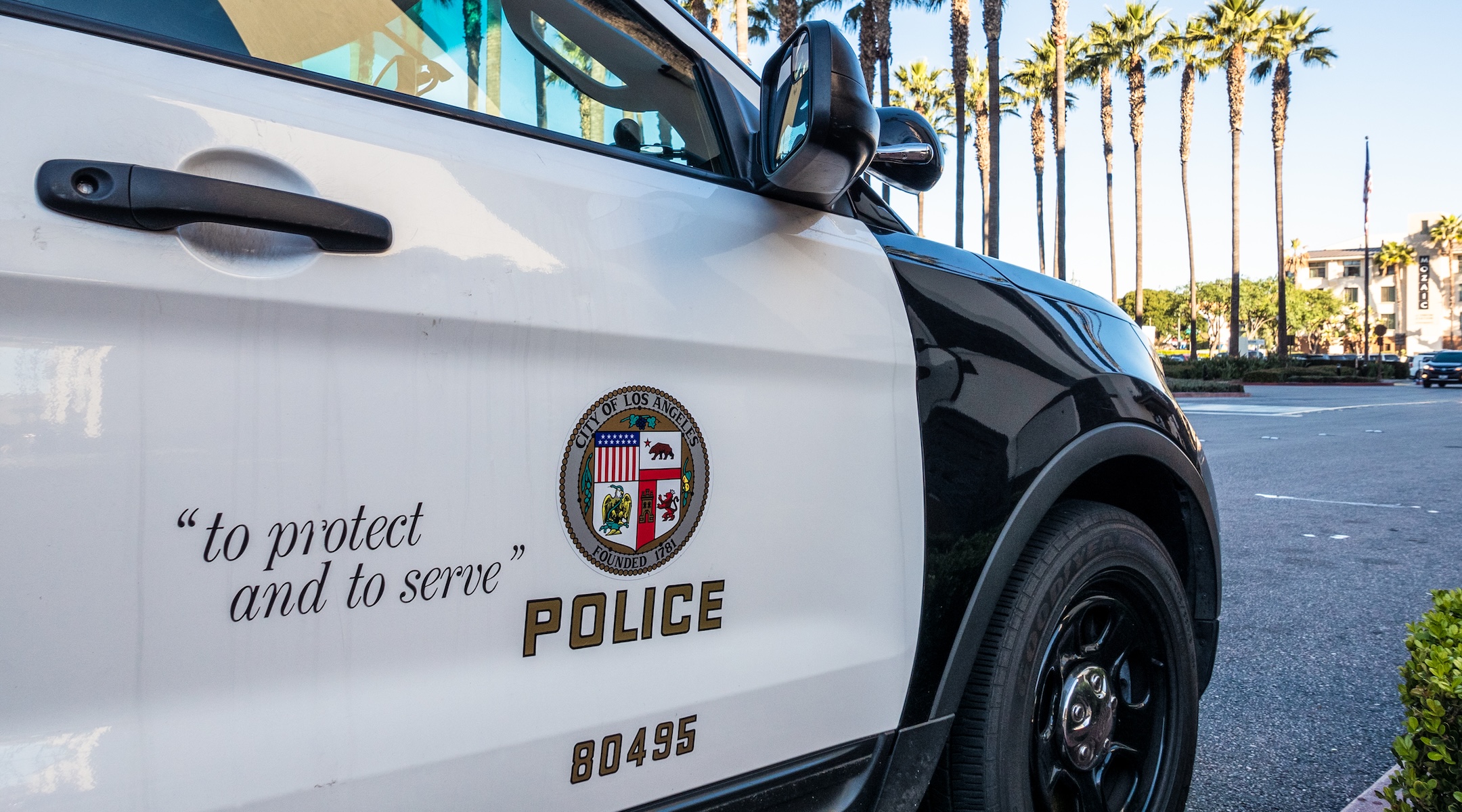 Close-up on the insignia and slogan of a LAPD vehicle. (Getty Images)