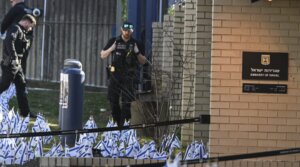 Police take security measures and investigate the crime scene after a member of the US Air Force set himself on fire outside the Israeli Embassy in Washington, D.C., to protest the war in Gaza on Feb. 25, 2024. (Celal Gunes/Anadolu via Getty Images)