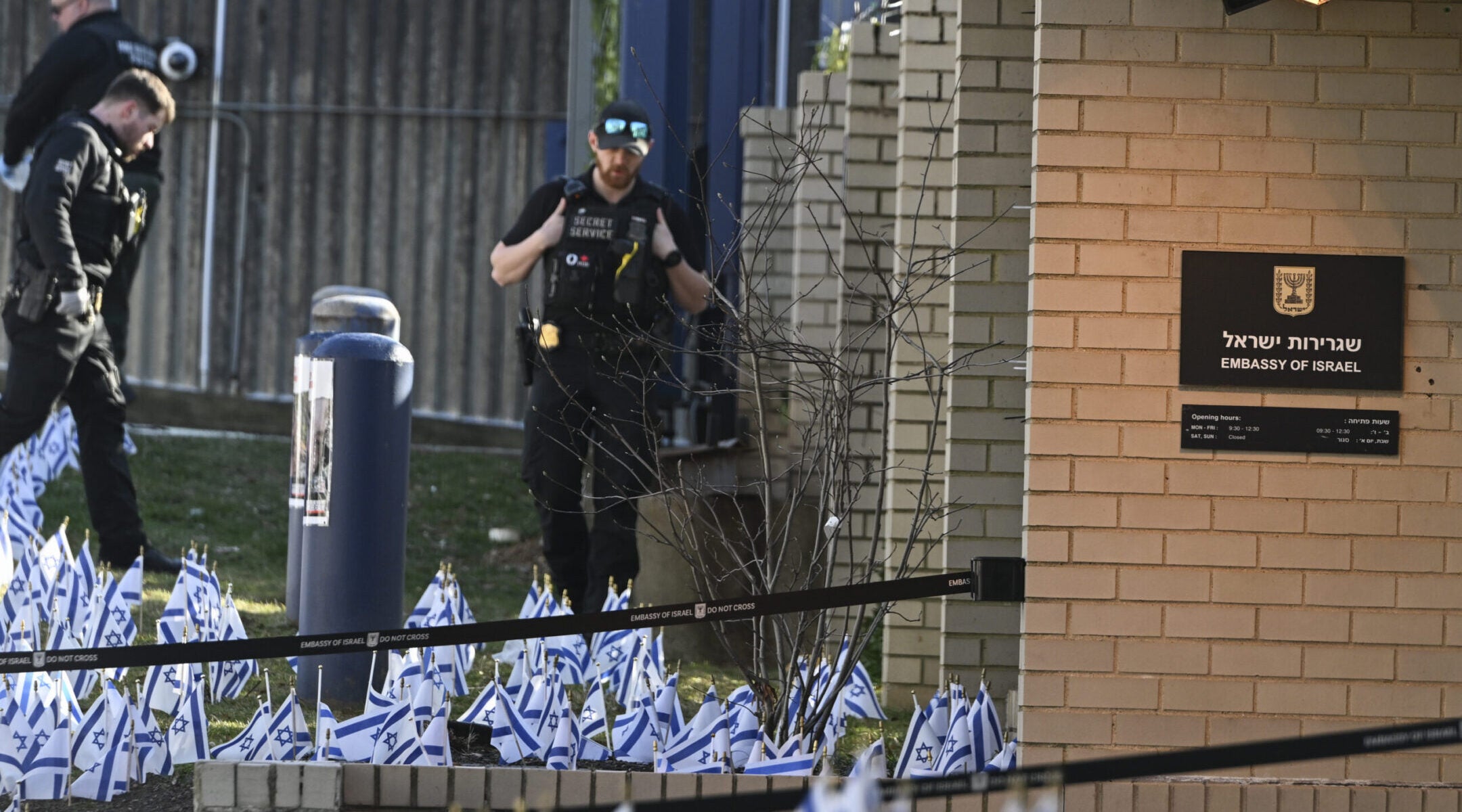 Police take security measures and investigate the crime scene after a member of the US Air Force set himself on fire outside the Israeli Embassy in Washington, D.C., to protest the war in Gaza on Feb. 25, 2024. (Celal Gunes/Anadolu via Getty Images)