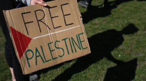 A demonstrator carries a Free Palestine sign at a youth march in London, April 5, 2025. (Martin Pope/SOPA Images/LightRocket via Getty Images)