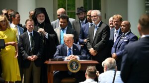 President Donald Trump and faith leaders listen to a song before he signs an executive order on the “Establishment of the Religious Liberty Commission” during a National Day of Prayer event in the Rose Garden of the White House in Washington, D.C., on May 1, 2025. (Mandel Ngan / AFP via Getty Images)