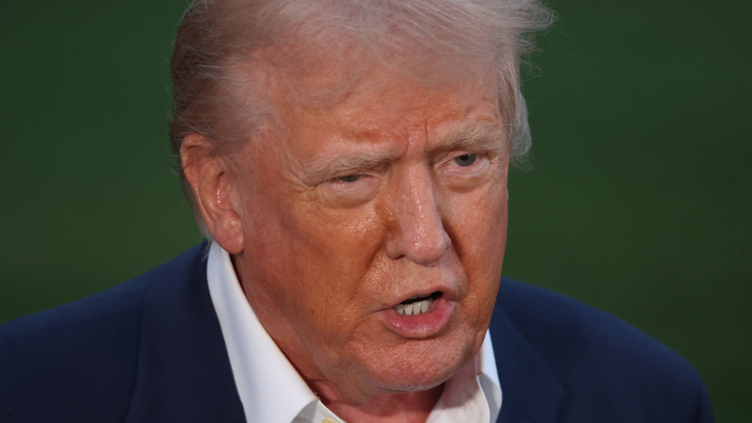 Donald Trump takes questions from the press on the South Lawn of the White House.