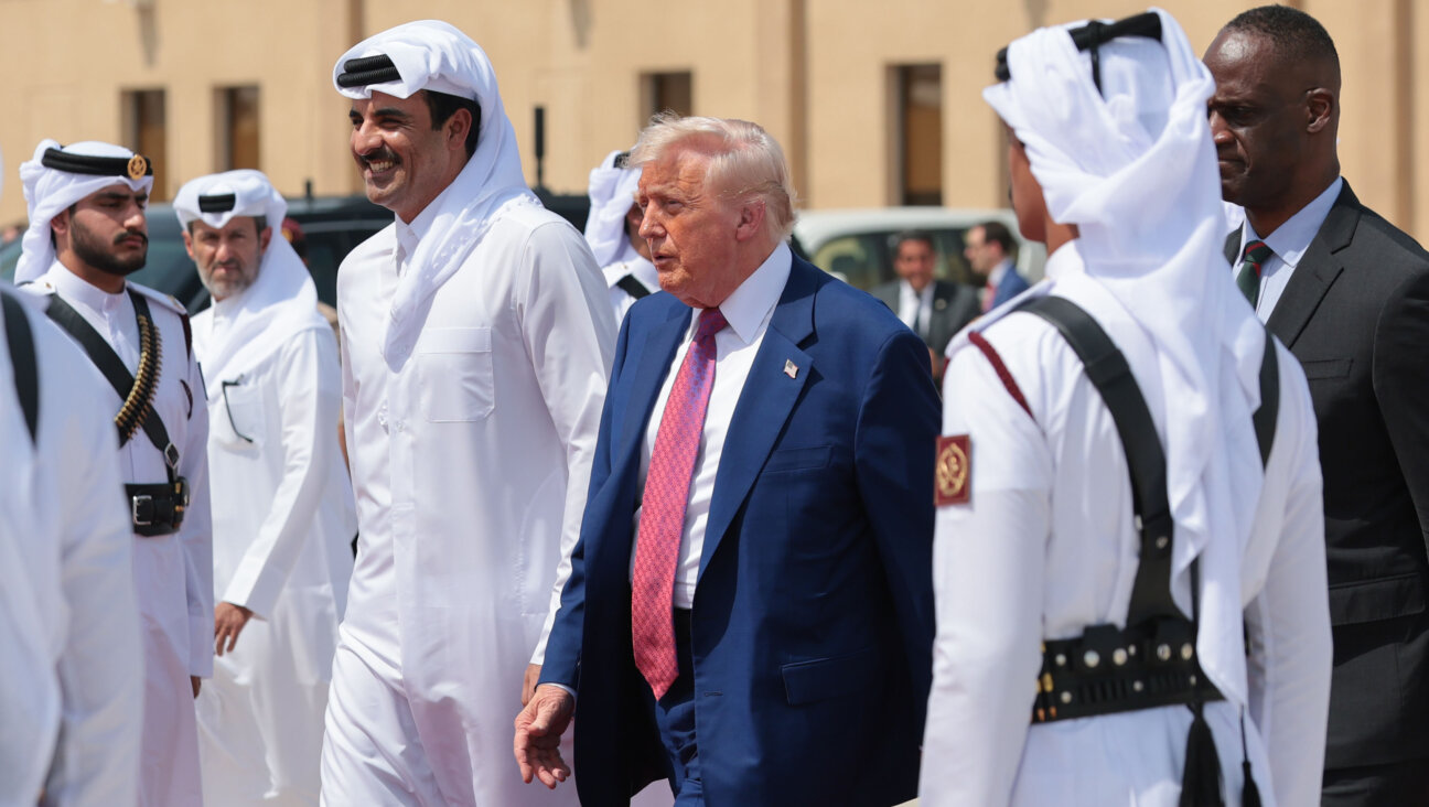 President Donald Trump speaks with Emir of Qatar Tamim bin Hamad al Thani in Doha on May 15.  