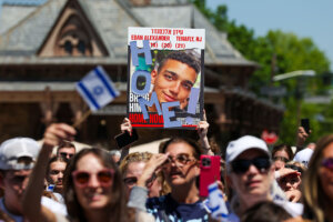 Hundreds of friends and  residents gather in Tenafly, New Jersey, to watch the release of Edan Alexander on May 12. 