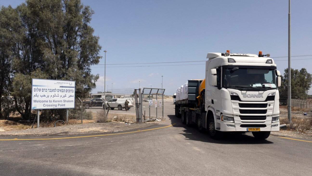 A humanitarian aid truck moves at the Israeli side of the Kerem Shalom Crossing Point on May 19, 2025 in Southern Israel. (Amir Levy/Getty Images)