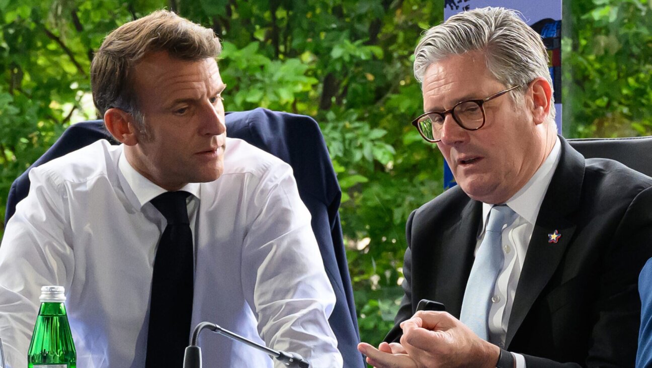 France’s President Emmanuel Macron and Britain’s Prime Minister Keir Starmer speak in Tirana, Albania, May 16, 2025. (Leon Neal/Getty Images)