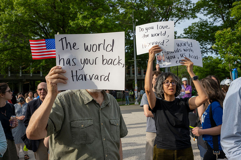 People hold signs during the Harvard Students for Freedom rally in support of international students at the Harvard University campus on May 27, 2025.