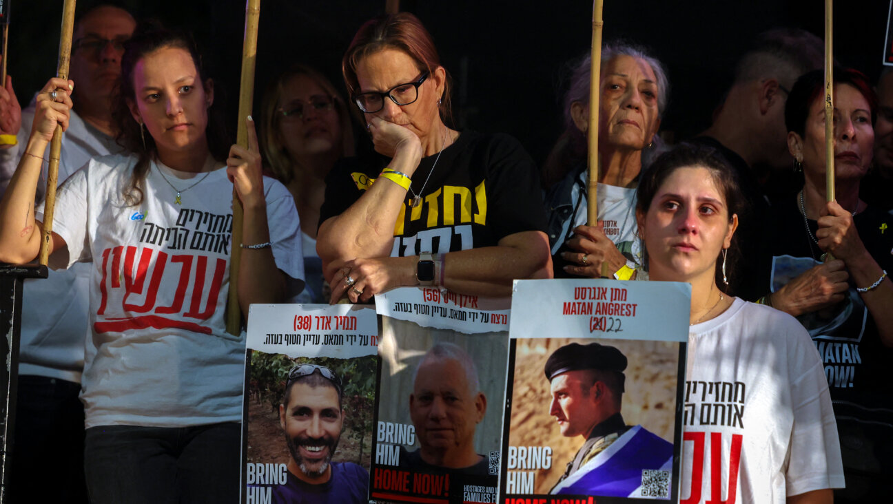 Relatives and supporters of Israeli hostages hold their portraits during a protest at Hostages Square in Tel Aviv on May 28, 2025, to mark 600 days of their captivity.