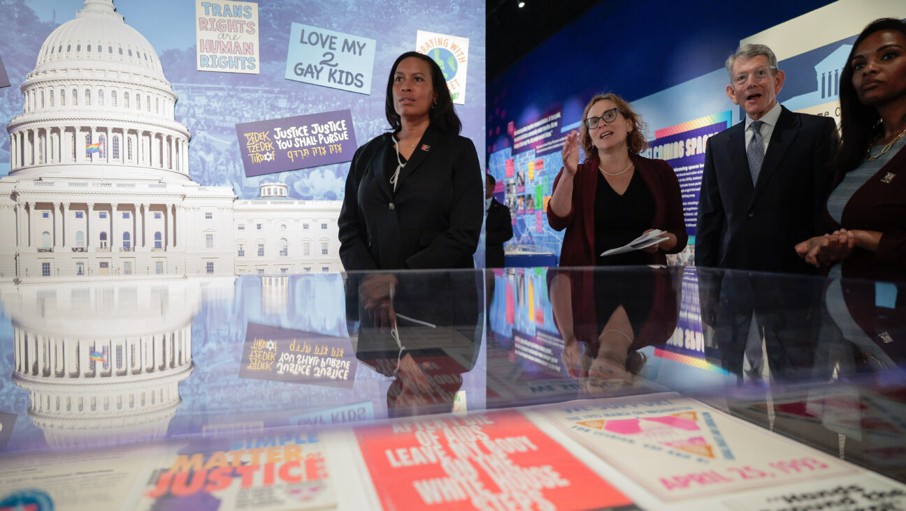 D.C. Mayor Muriel Bowser, left, is given a tour of the Capital Jewish Museum by Executive Director Beatrice Gurwitz and President Chris Wolf following a remembrance and reopening ceremony on Thursday.