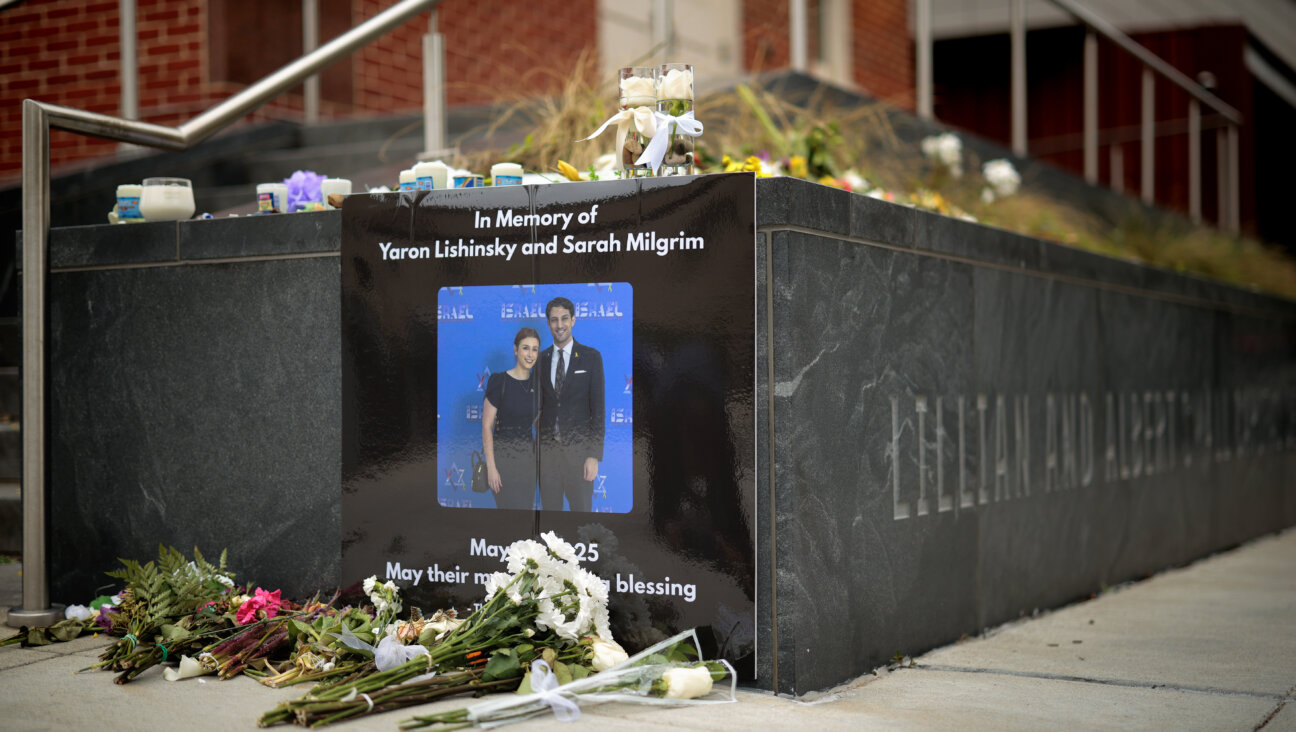 A photograph of Sarah Milgrim and Yaron Lischinsky is displayed outside the Capital Jewish Museum in Washington, D.C., May 29. 