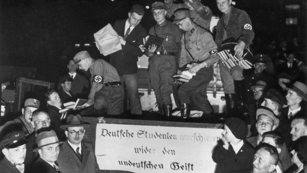 Nazi youth collect 'un-German' books from the back of a truck, 1933.