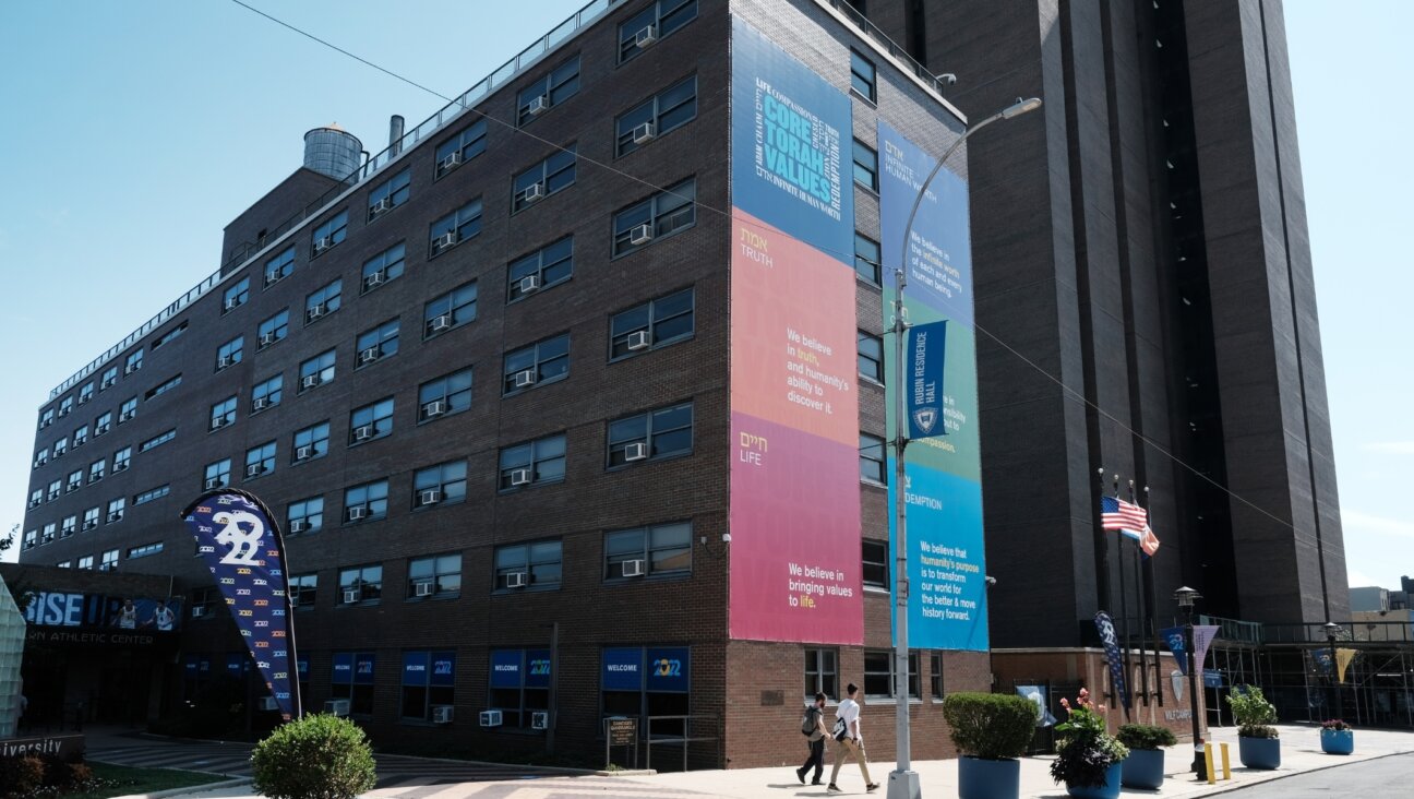 A sign on the Yeshiva University Wilf campus in Washington Heights boasts of the school’s core Torah values. (Spencer Platt/Getty Images)