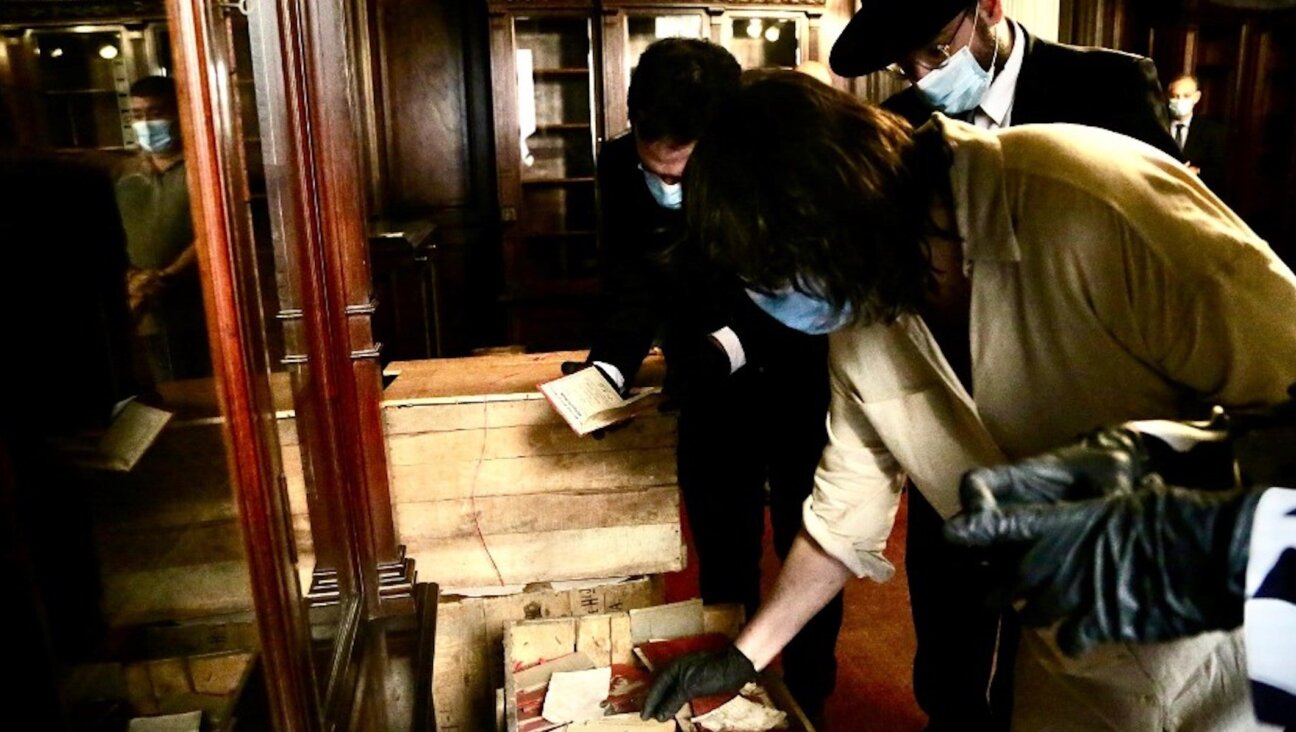 The contents of the boxes found by the Argentian Supreme Court are examined under preservation protocols. (Supreme Court of Justice of the Nation)