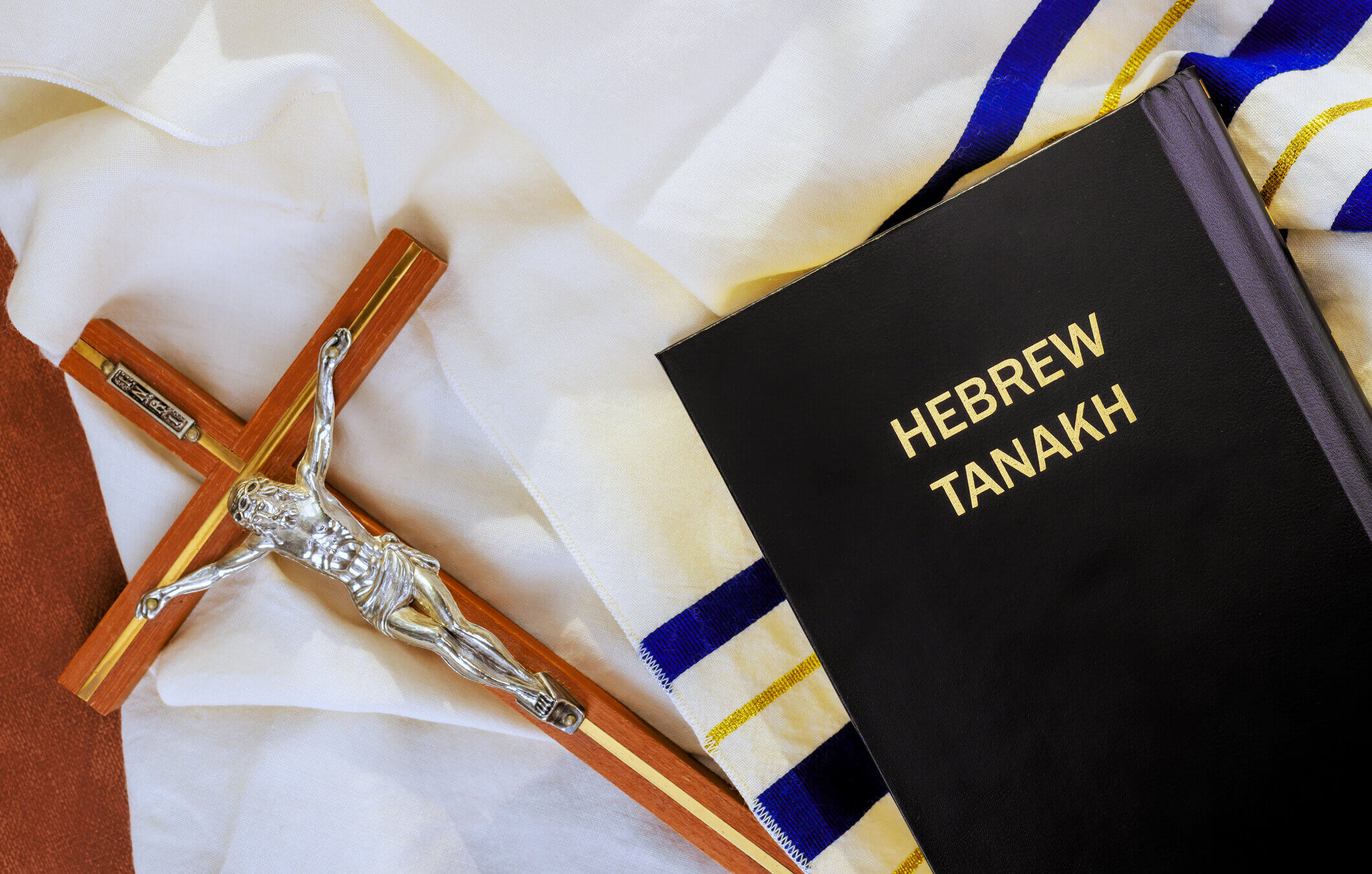 Crucifix, Hebrew Tanakh on tallit prayer shawl.