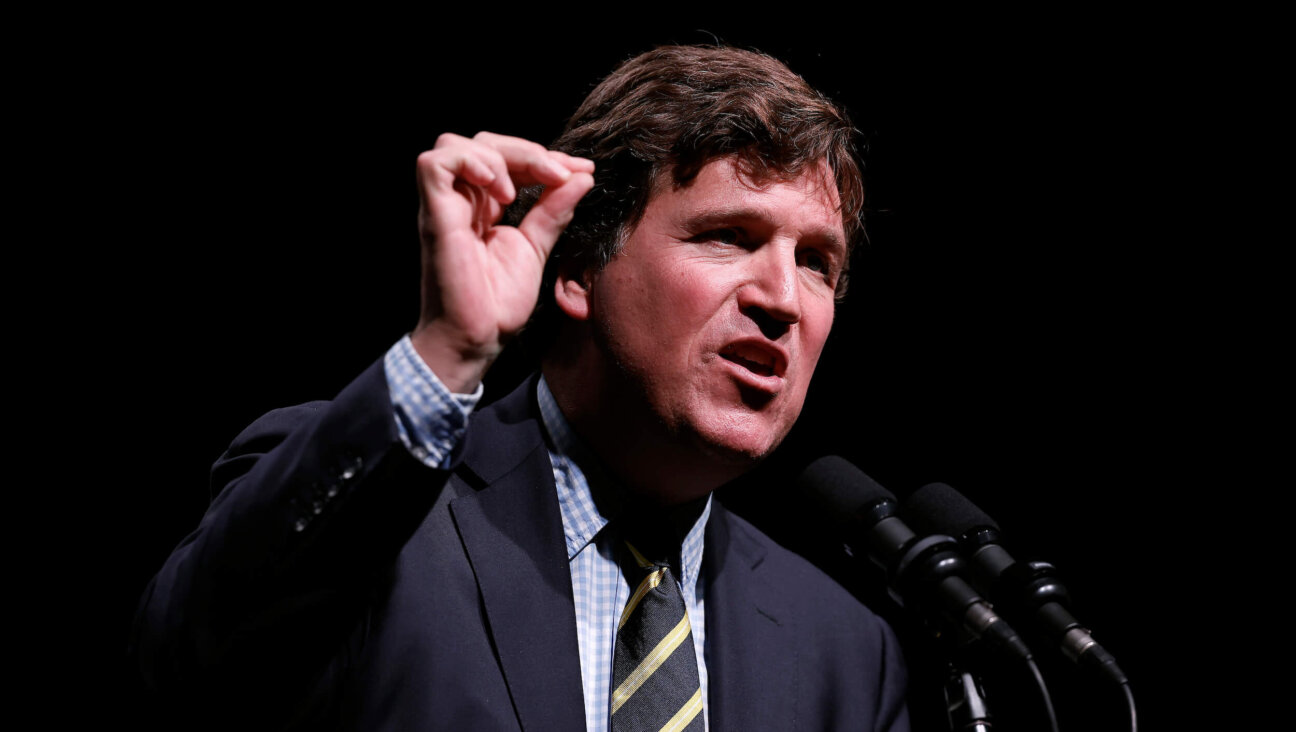 Tucker Carlson speaks at the Desert Diamond Arena on Oct. 31, 2024, in Phoenix, Arizona.