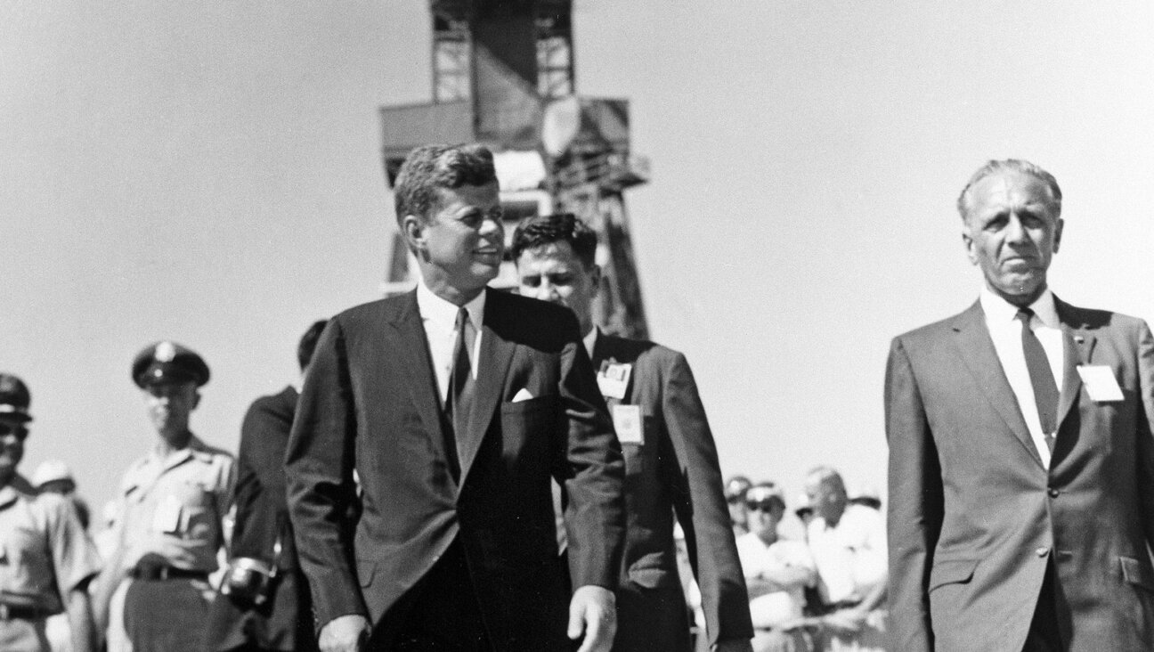 Former President John. F Kennedy tours Cape Canaveral with Kurt H. Debus, then director of the Launch Operations Center, on Sept. 11, 1962.