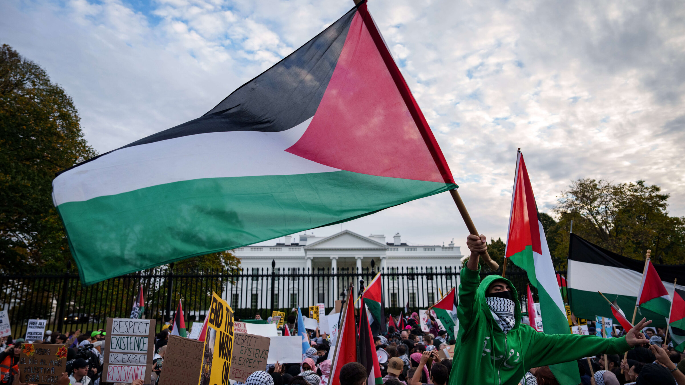 Demonstrators fly Palestinian flags outside the White House during the National March on Washington for Palestine, Nov. 4, 2023.