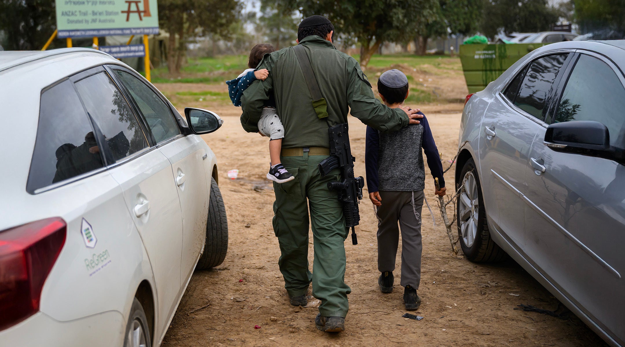 Israeli children visit their reservist father on Dec. 17, 2023 in Southern Israel. (Alexi J. Rosenfeld/Getty Images)