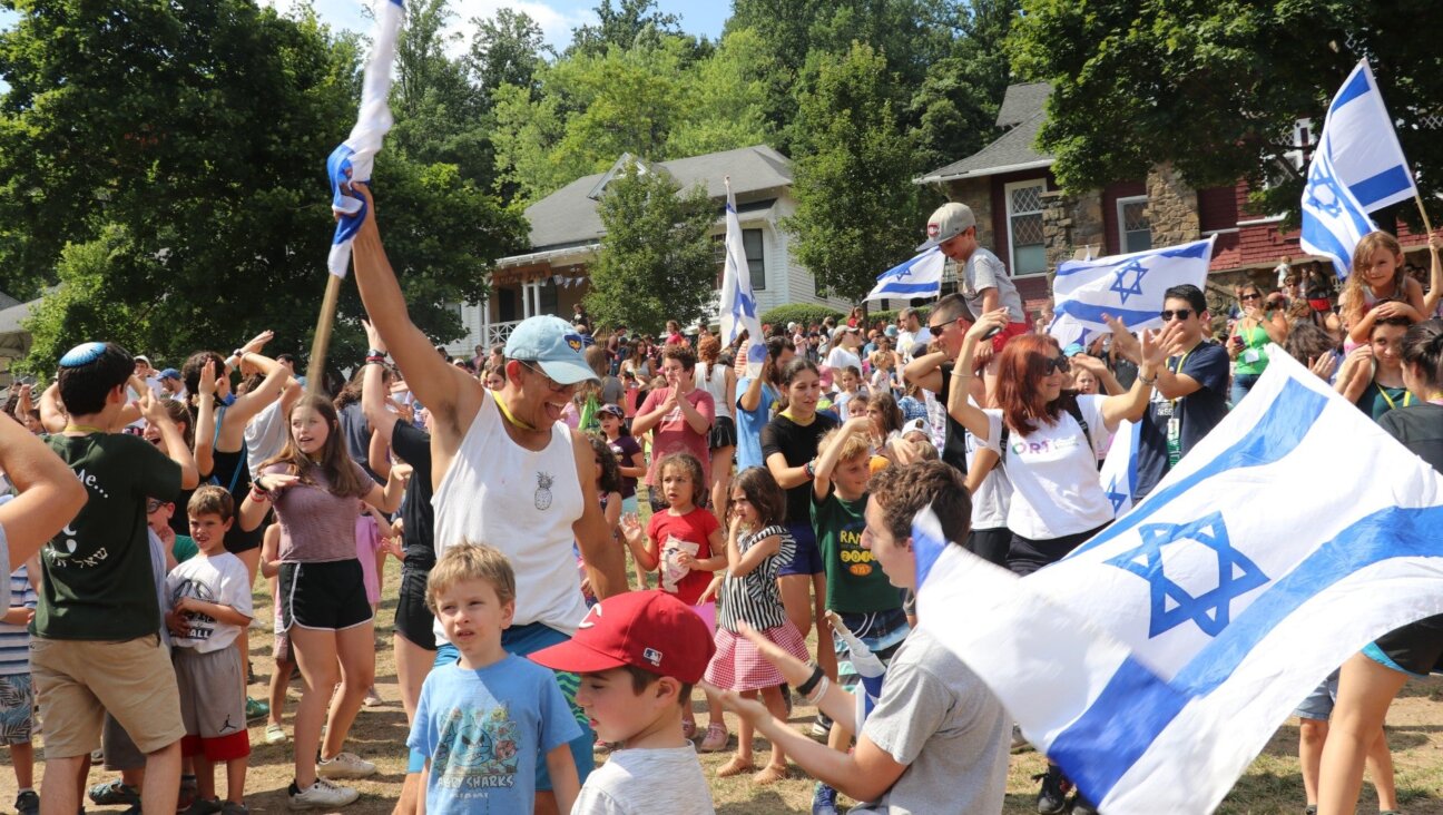 On the last Friday of the season at Camp Ramah Nyack in 2019, anyone spending the next year in Israel is called up and invited to dance with the Israeli staffers in a Zionist celebration. (Courtesy of Ramah Nyack)