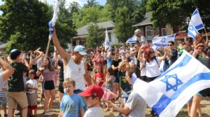 On the last Friday of the season at Camp Ramah Nyack in 2019, anyone spending the next year in Israel is called up and invited to dance with the Israeli staffers in a Zionist celebration. (Courtesy of Ramah Nyack)